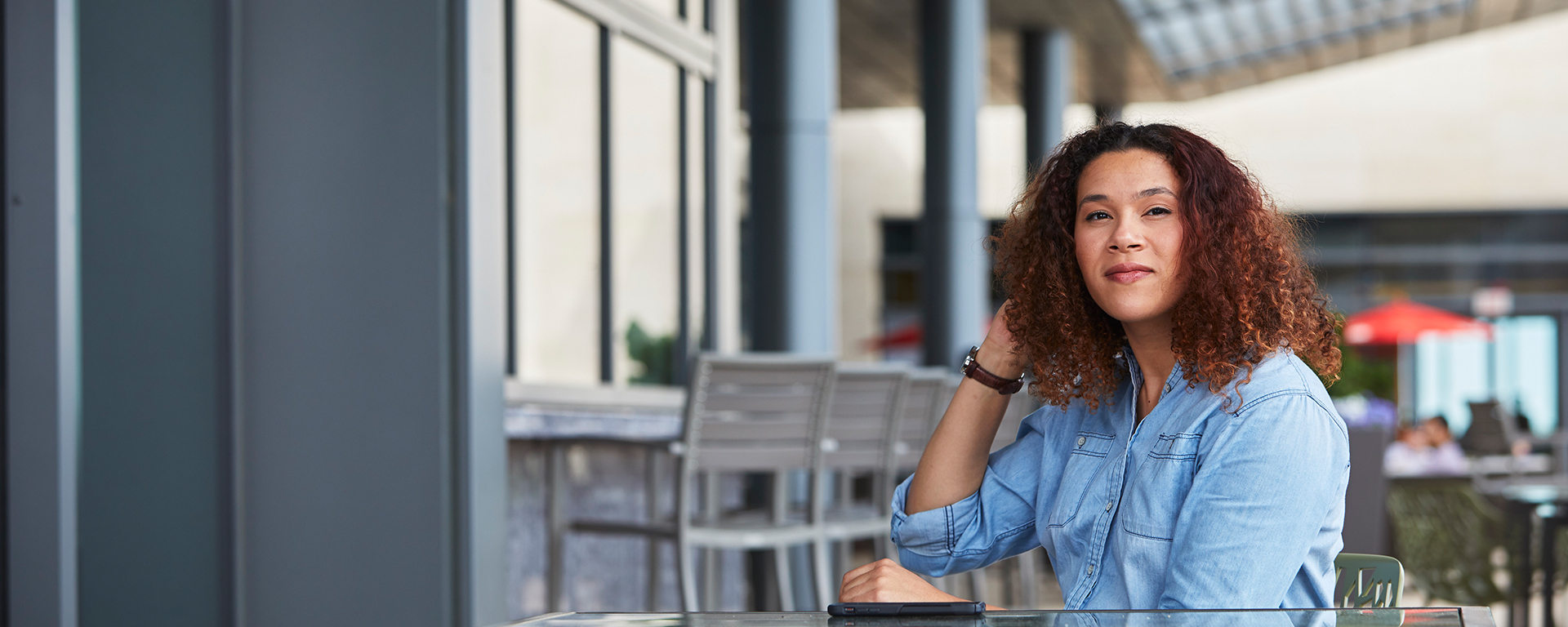 Tia, a Capital One Tech associate, sits outside and talks about her day in the life at Capital One