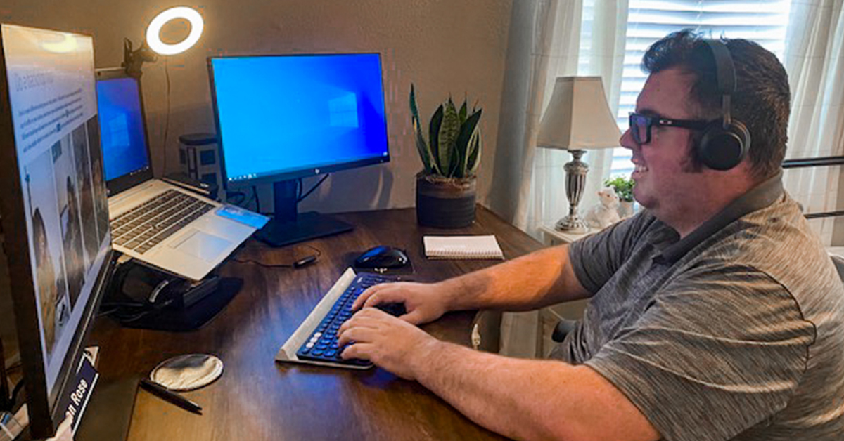 Ethan maintains a steady stream of conversations with colleagues through instant messaging.