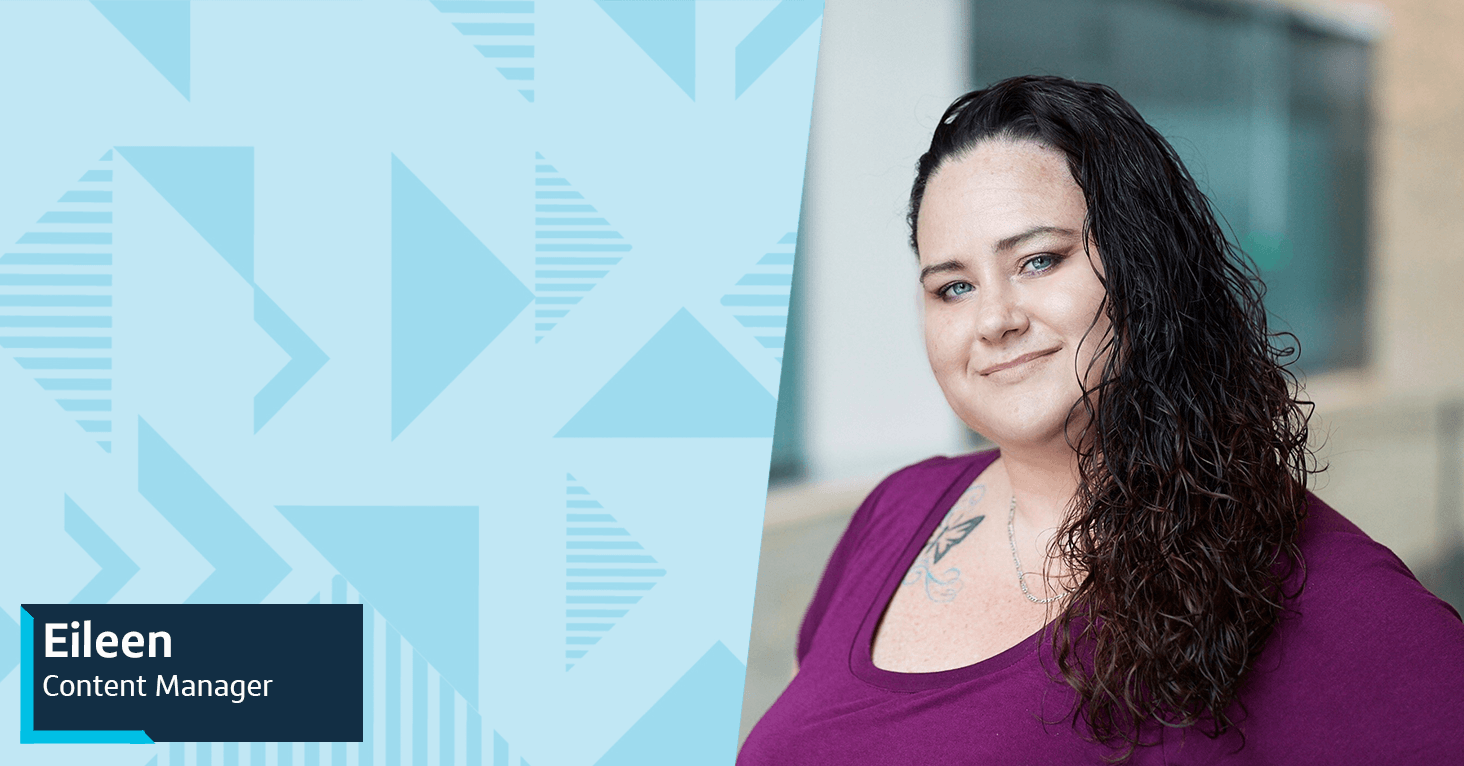 Eileen, Content Manager at Capital One, stands and smiles in front of a blurred background, with a two-toned blue triangular patterned background to the left of her image